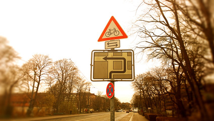 too many signs, urban alley, focus in center image and edge blur