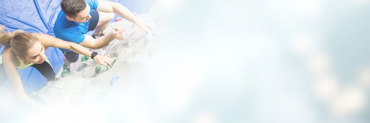 Obraz premium Fit woman rock climbing indoors 