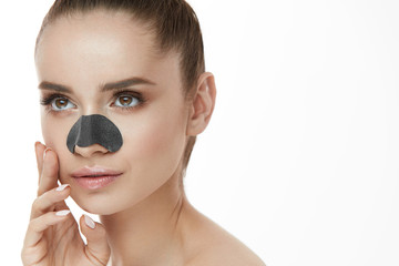 Beautiful Woman With Beauty Face And Skin Care Patch On Nose