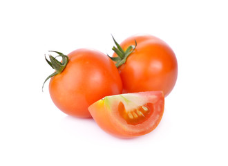 whole and portion cut fresh tomato on white background