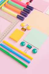 Office supplies on the pink background table