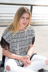 Blonde teenage girl with her pants torn fashion