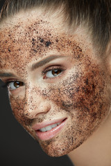 Beauty Face. Closeup Of Woman With Coffee Mask, Scrub On Skin