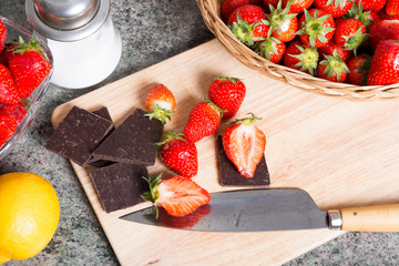 Strawberries with a dark chocolate bar