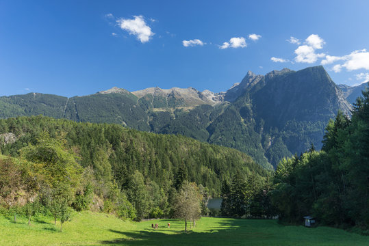 Landscape protection area Achst&uuml;rze. Lake Piburger See, Tirol oldest nature preserves. Oetz alps, unique cultural mountains landscape, alps in the background. &Ouml;tztal valley.