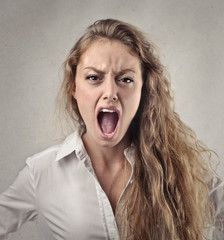 Angry blonde woman screaming