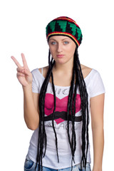 Girl in a hat shows a peace sign