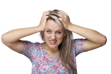 frustrated and angry woman is pulling her hair