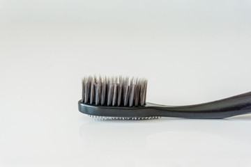 Close up of a new toothbrush without a paste, on a white background. Health concept.