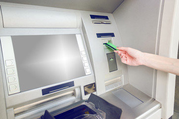 hand insert card in the ATM