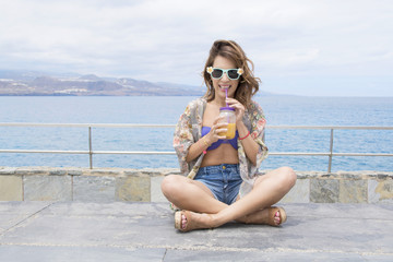 The young woman enjoys fresh juice in her free time.