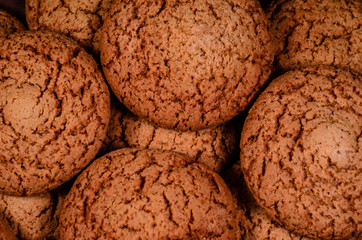 Stack of the oatmeal cookies on wooden table