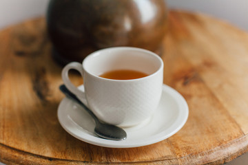 cup of hot tea on a wooden table