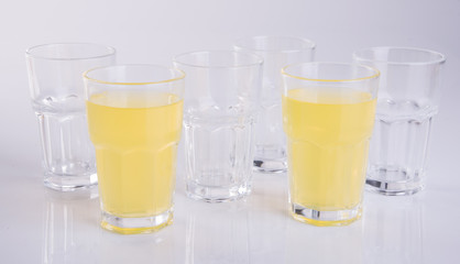 Orange juice in glasses on white background.