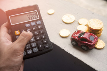 hand pick the calculator and car with coin money