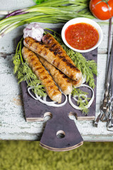 Grilled sausage with sauce and vegetables