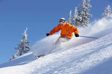 Man skiing down slope