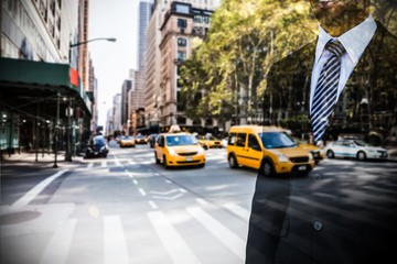 Composite image of smiling businessman looking away