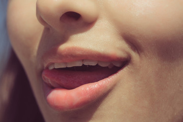 Naklejka premium tongue licking sexy, plump lips