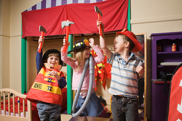 Children pretending to be firefighters