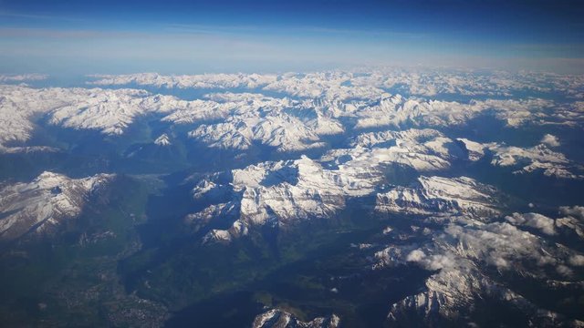 High quality aerial shot above high moutains Alps in 4k