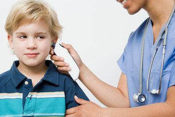 Boy with thermometer in ear