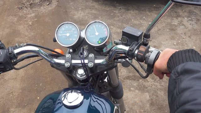 Motorcyclist turns the throttle stick. 4k video