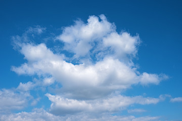 White clouds against blue sky background