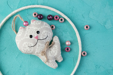 Baby crib mobile on turquoise background