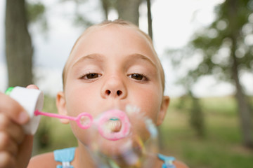 Girl using a bubble wand
