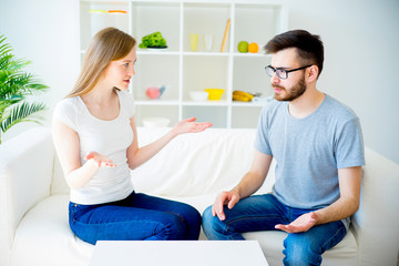 Loving couple swears on the sofa