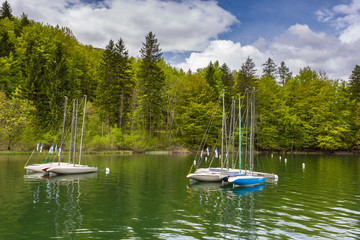 Fototapeta na wymiar Boats in marina at Bohinj Lake, Julian Alps, Slovenia