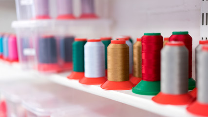 Shelf with colorful sewing yarn
