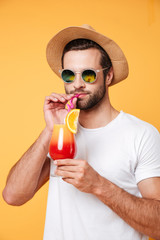 Serious man in sunglasses drink cocktail