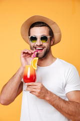 Man in sunglasses holding cocktail