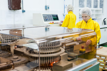 Two Women working at the pharmaceutical factory. Shallow DOFF. See more images and video from this series. 