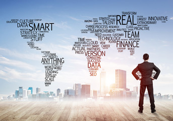 Motivation and inspiration concept with modern cityscape and businessman observing it