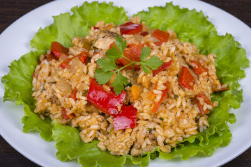 Rice with vegetables and chicken in a curry sauce.