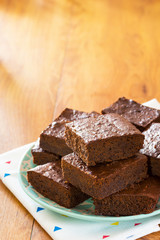Chocolate Brownies Piled High on a Plate