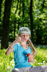 blowing soap bubbles