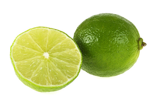 Whole and sliced lime isolated on a white background