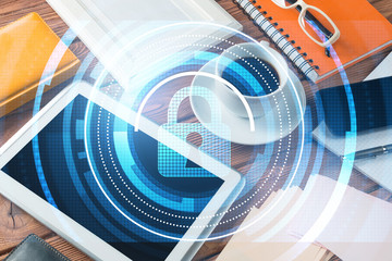 Obraz premium Business workplace with tablet pc and security concept on screen