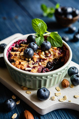 Blueberry crumble with oat flakes and almonds