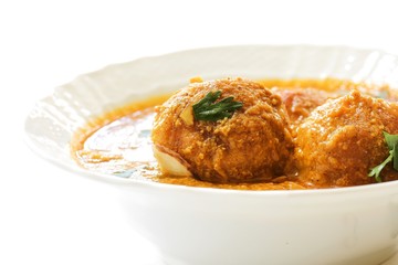 Malai Kofta / Indian Cottage cheese balls curry on white background, selective focus