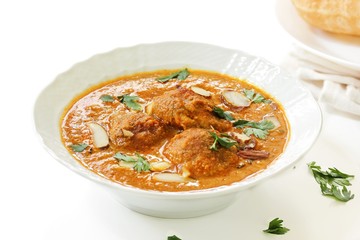 Malai Kofta / Indian Cottage cheese balls curry on white background, selective focus