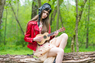Girl Pilot Playing Guitar In The Woods