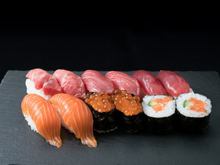 sushi set on black plate