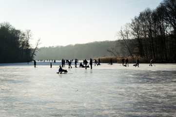 Ice-skating on a sunny day, Schlachtensee, Berlin, Germany