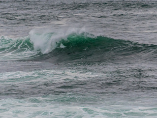 Glassy Teal Wave Rolling Over