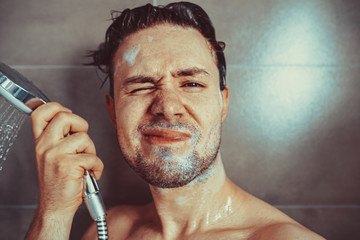 Young man washing head